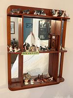 Overall view of wall shelf with all figurines displayed