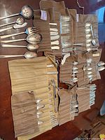 overview of flatware pieces in flannel rolls