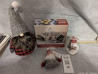 All items together: large gnome, boxed star tealight holder, small gnome ornament, globe ornament