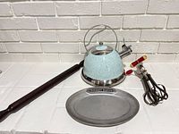 Group shot of kettle, egg beater, tray, rolling pin