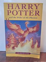 Front cover showing title, author, phoenix artwork, Bloomsbury imprint