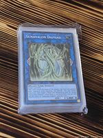 Front view of sleeved Sunavalon Daphne card on top of stack