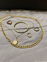 All six jewelry pieces laid out