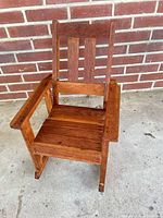 Front view of child-size Mission style wooden rocking chair