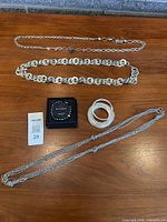 Full lot showing three necklaces, boxed Kitsune bracelet, stack of bangles