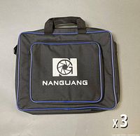 Front view of one Nanguang bag showing logo, blue piping, handles