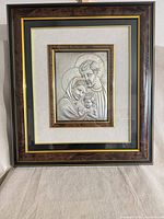 Full view of framed Holy Family metal relief plaque