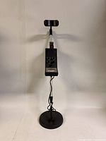 Full view of metal detector showing coil, shaft, control box and armrest