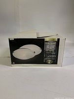 Front of box showing image of flush mount light and branding