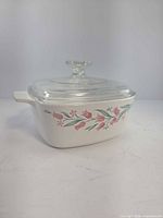 Side view of casserole with lid showing floral pattern