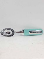 Overall view of KitchenAid ice cream scoop showing full profile