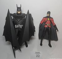 Front view of Batman and Red Robin figures side by side