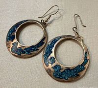 Front view of both hoop earrings showing turquoise inlay and open center design