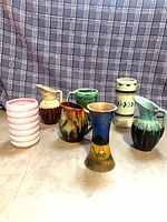 Seven pottery pieces arranged together