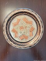 front view showing full etched and inlaid design