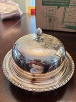 Dish with lid assembled showing engraving and rim detail