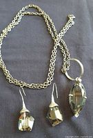 Full set showing necklace with pendant and both earrings