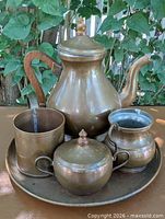 Full view of copper coffee service on tray