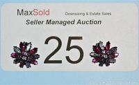 Pair of Sherman clip-on earrings shown on a numbered MaxSold auction card. Earrings have pink and clear rhinestones in a japanned metal prong setting arranged in a floral burst pattern.