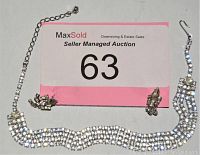 Photo of the necklace and matching pierced earrings arranged on a white background with a MaxSold auction card.