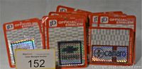 Photo of 17 official automobile emblems in original packaging with holographic authenticity stickers, visible brands include Chevrolet and Camaro