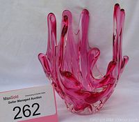 Freeform pink glass decorative centerpiece with irregular wavy rim
