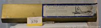 Long yellowed box labeled 'R-C Aero Flash' containing the wooden model airplane kit.