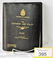 Black textured binder with gold lettering and Department of Transport crest on the front cover, titled 'The Canada Air Pilot East Volume Two Winnipeg to Newfoundland'.