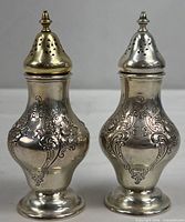 Front view of both Gorham sterling shakers