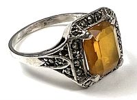 Profile view showing citrine center, marcasite border, silver band