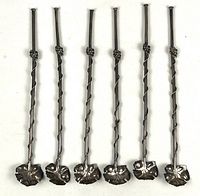 All six silver straw spoons laid out front view