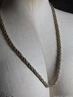 Full view of necklace draped on display bust