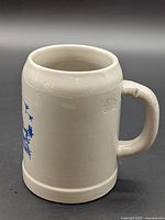 Full view of stoneware beer stein showing handle