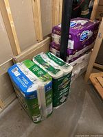 Stacked packs: two Bounty 12-roll paper towels and three Royale Velour 30=80 roll toilet papers