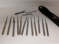 Full set of 12 picks, 3 tension tools, and open case flap
