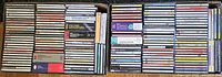 Two cartons filled with row-packed classical music CDs