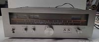 Front view of Kenwood KT-8300 tuner showing entire faceplate, meters, tuning scale, and controls