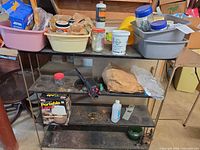 Front view of cart with all items visible on three shelves