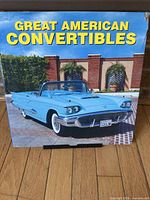 Front cover showing title and classic blue convertible