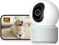Camera next to smartphone displaying 4K video sample