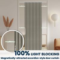 Gray accordion door curtain installed in doorway, demonstrating light blocking