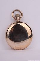 Closed back view of gold-filled hunter case