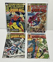 Front view of four bagged Spectacular Spider-Man comics (#35, 36, 38, 39)