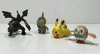 Front view of all four Pokémon figures