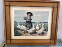 Full view of framed print showing image, mat and frame