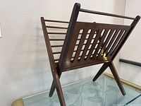 angled view showing slatted design and foldable legs