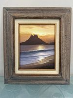 Frontal view of framed oil painting showing artwork and frame detail