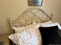 Front view of metal double headboard attached to bed