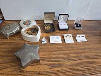Overall lot view showing jewelry items and trinket boxes