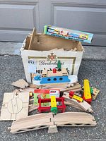 Overview of box with Brio track pieces, crane, ferry and sealed Mini-Godståg set